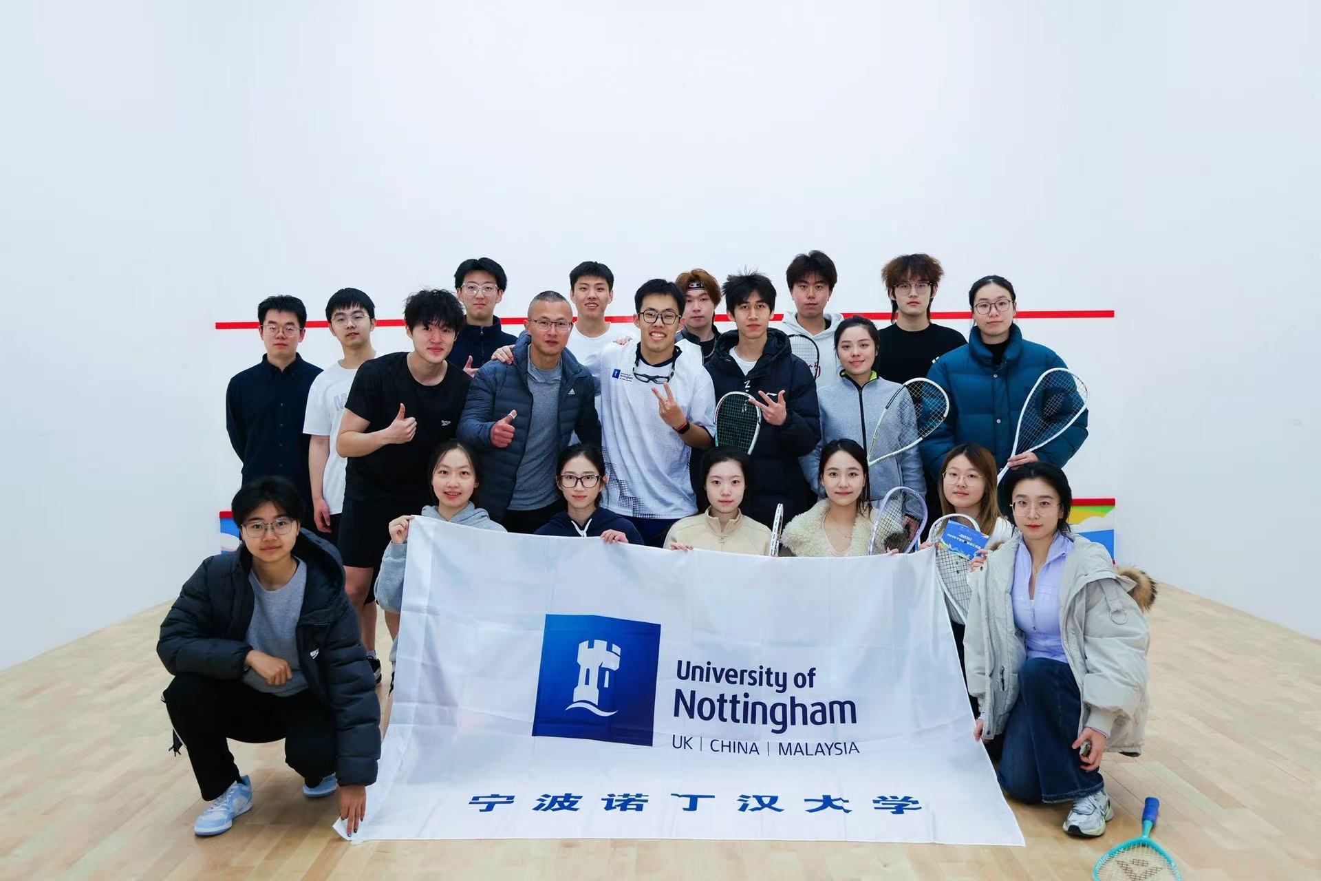 Squash group with Nottingham flag